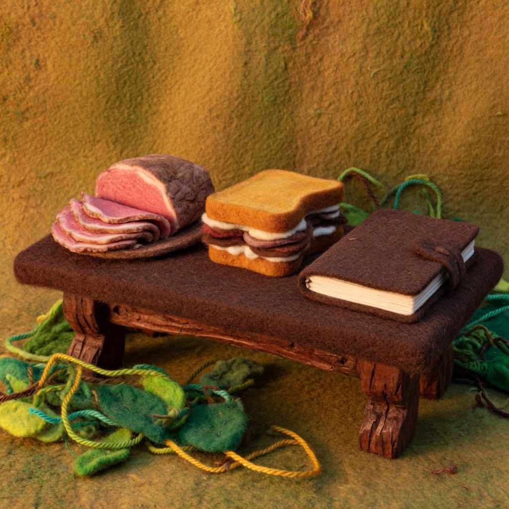 Cold meat, a beef sandwich and a blank diary on a club table